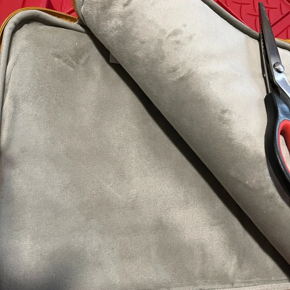 Brand new without tag or box. Laptop Sleeve. Quilted tan/golden plush inside.!